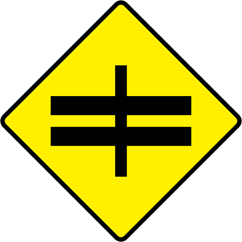 A triangular warning traffic sign in Ireland depicting crossroads ahead at dual c'way. Memorize for DTT.