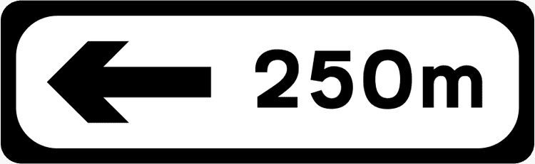 A common road sign in Ireland for direction and distance - left. Driving Theory Test revision.