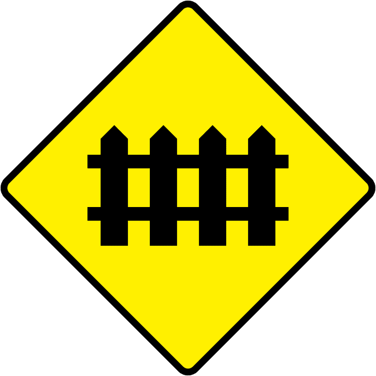 A triangular warning traffic sign in Ireland depicting level crossing with no flashing red signals. Memorize for DTT.