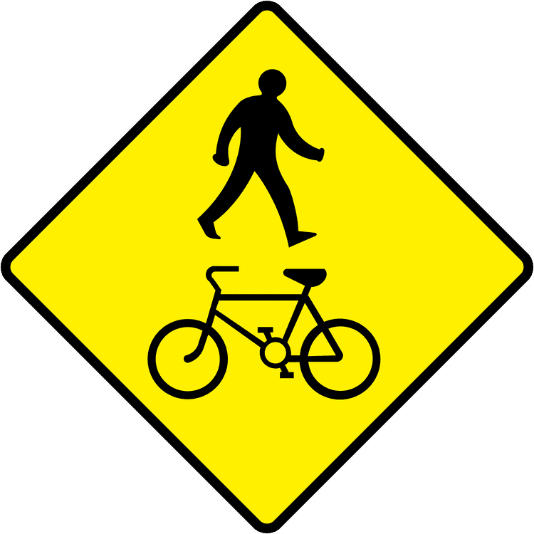 A triangular warning traffic sign in Ireland depicting pedestrian cycle crossing. Memorize for DTT.