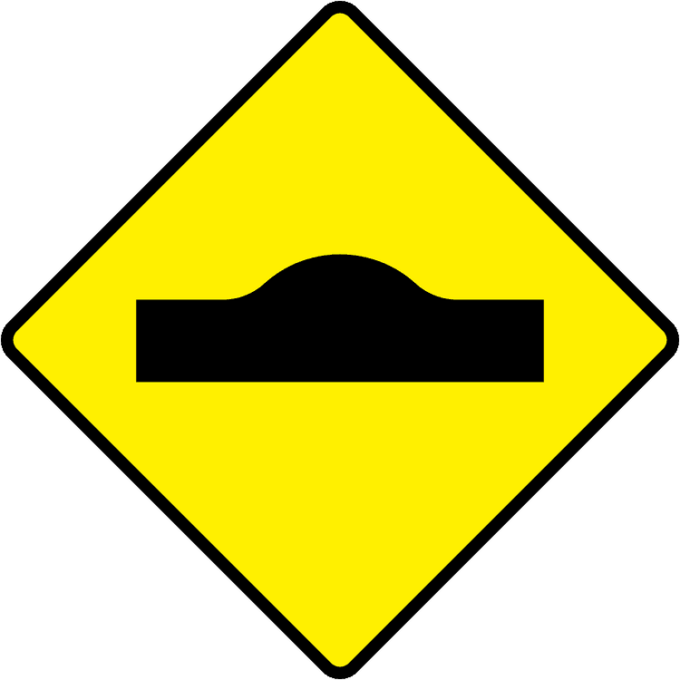 A triangular warning traffic sign in Ireland depicting road hump. Memorize for DTT.