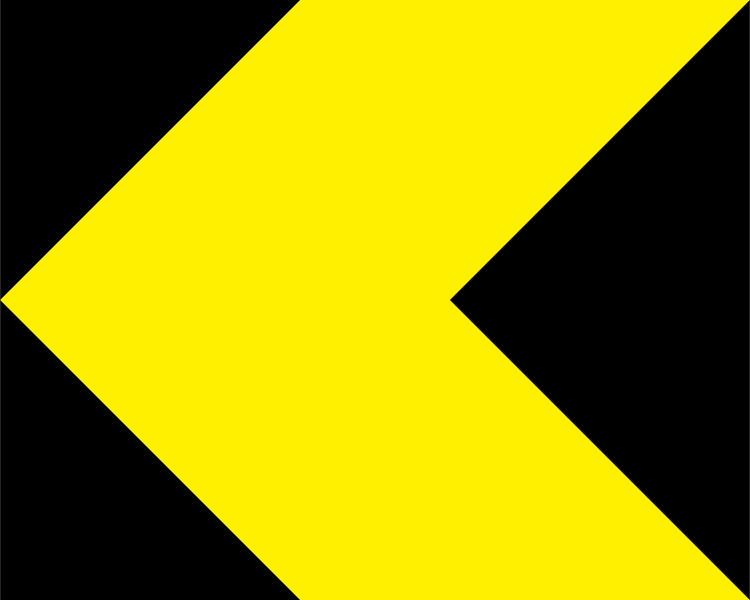 A triangular warning traffic sign in Ireland depicting single chevron - left. Memorize for DTT.