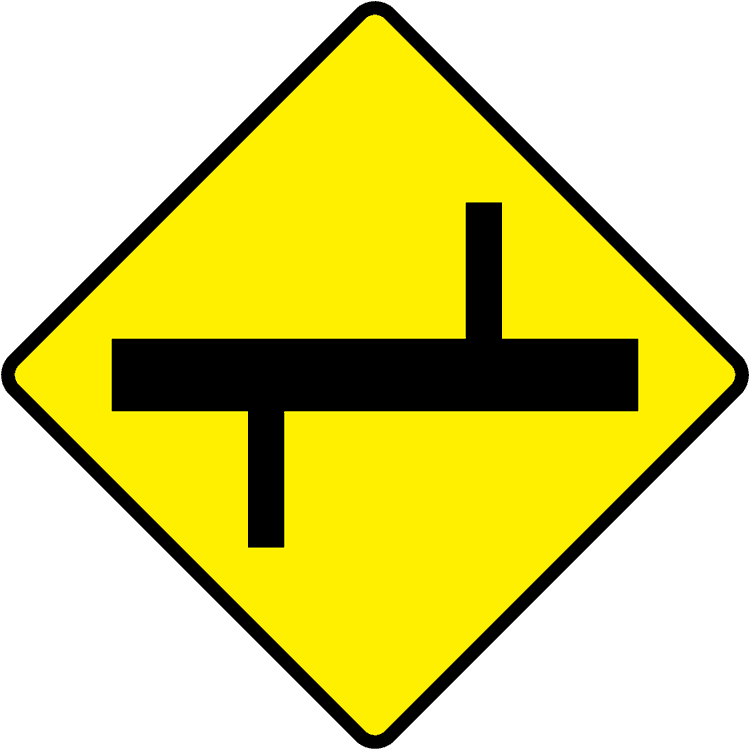 A triangular warning traffic sign in Ireland depicting staggered crossroads ahead - right. Memorize for DTT.