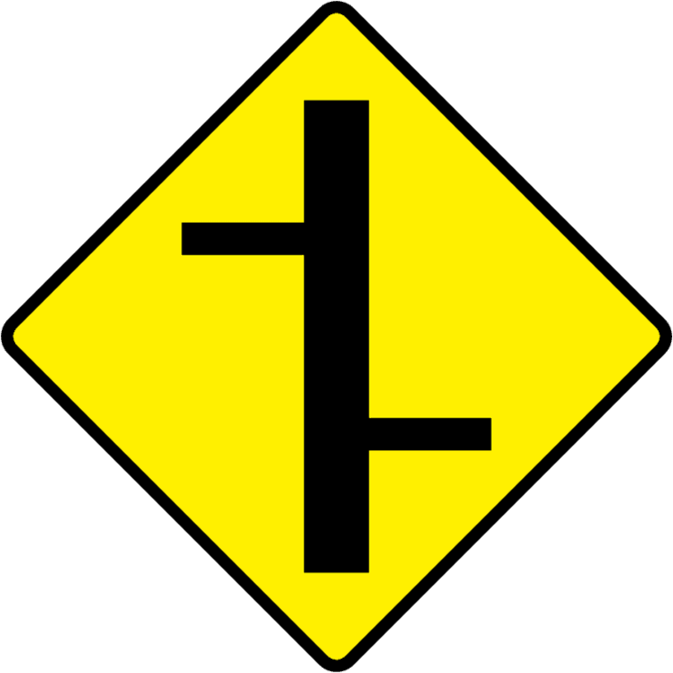 A triangular warning traffic sign in Ireland depicting staggered junctions - right left. Memorize for DTT.