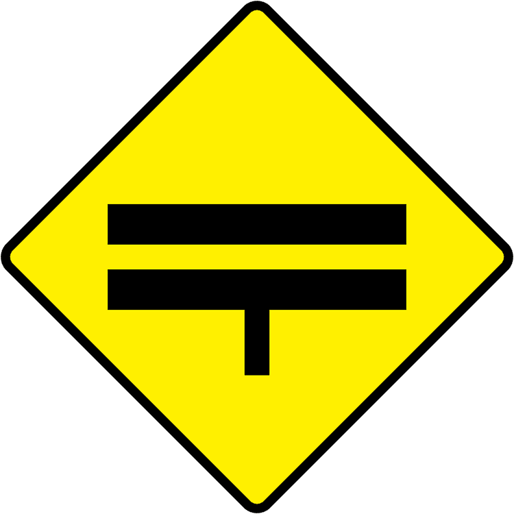 A triangular warning traffic sign in Ireland depicting t junction ahead at dual c'way (no cr break). Memorize for DTT.